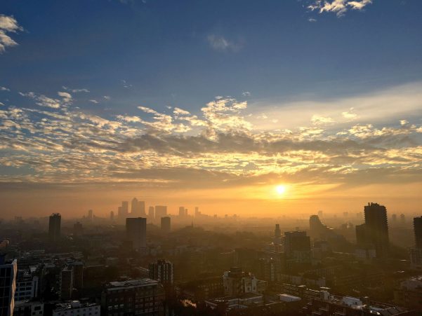 London skyline at sunrise showing tall buildings and tower blocks