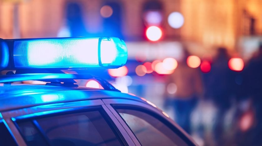 Blue lights on the top of a police car flashing
